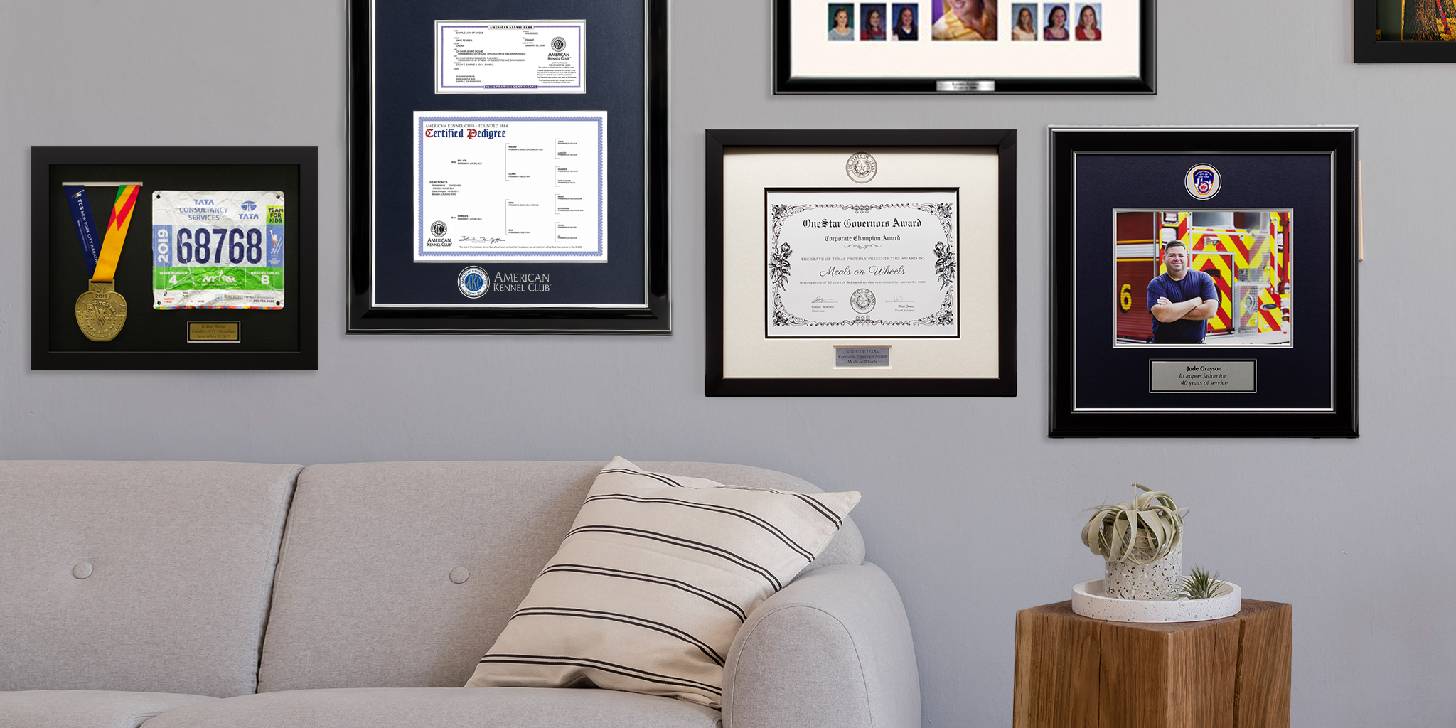 gallery wall of custom frames and shadow boxes hung on wall above couch